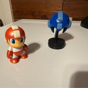 Mega Man Figurine Duo - Red 3” Mini and Blue Helmet on Stand